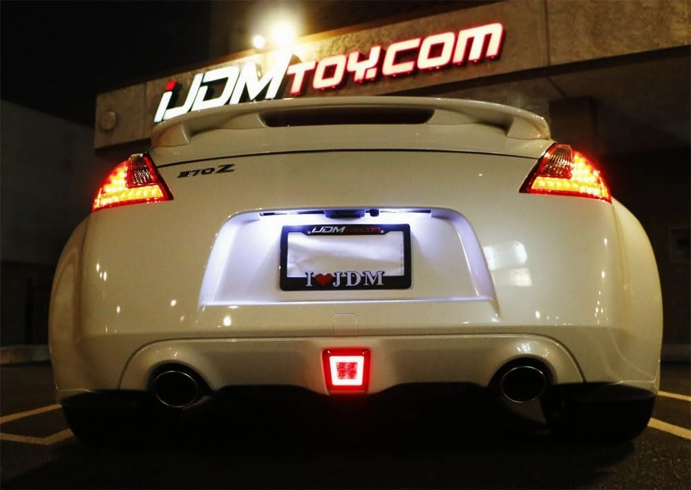 iJDMTOY Dark Smoked Lens LED Rear Fog Light Kit Compatible with 2009-2020 Nissan 370Z & 13-17 Juke Nismo, Powered by Red LED as Brake/Rear Fog & White LED as Backup Reverse Lamp